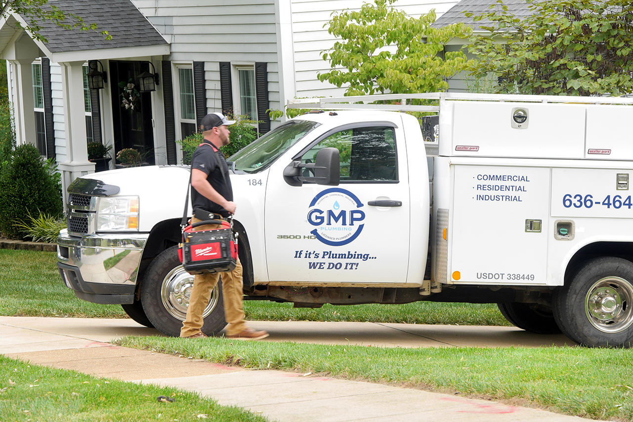 Plumber walking to his truck